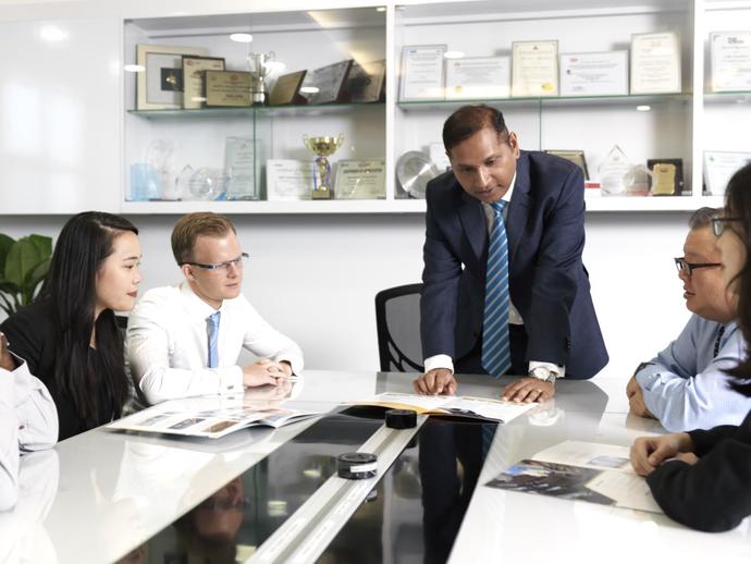 Diverse Keller employees meeting around a table